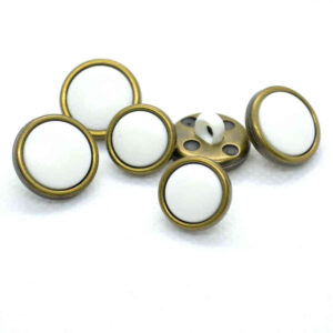 Brass rim white buttons