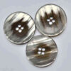 Pearlescent coat button