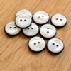 Black rim white pearlescent buttons